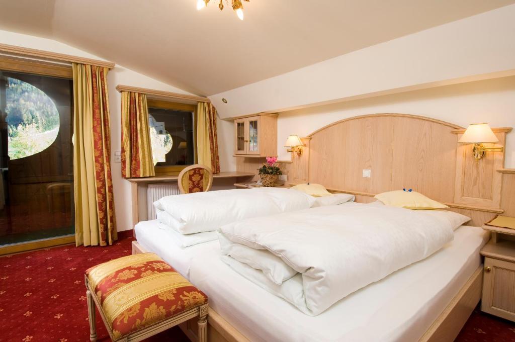 Doppelzimmer mit Balkon und Gartenblick
